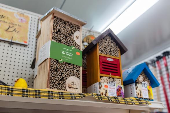 Two tall insect hotels equipped with sections of bamboo.