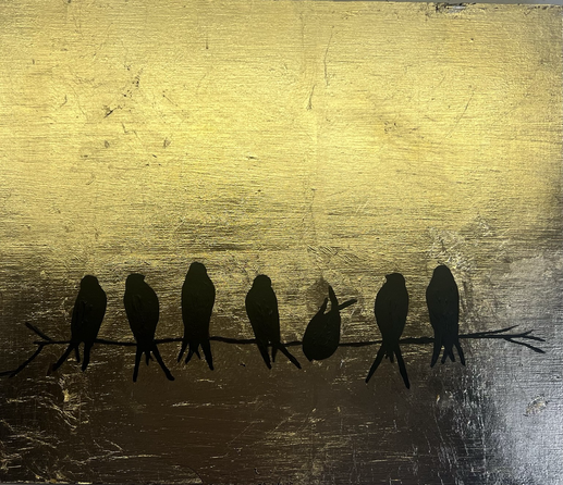Gold leaf on board with black acrylic birds sitting on a branch.