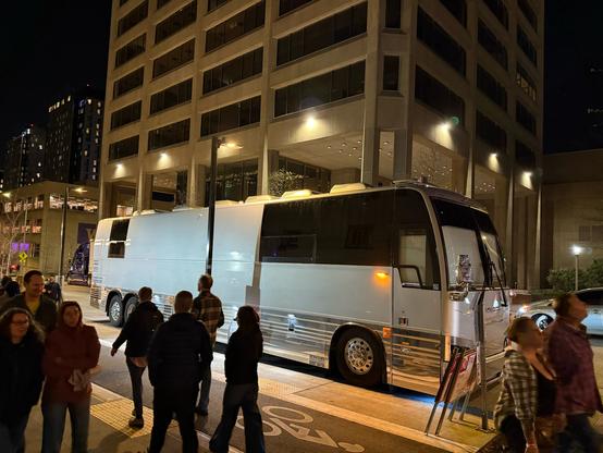 The tour bus outside
