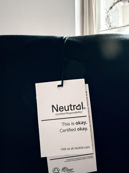 T-shirt tag with the text “This is okay”