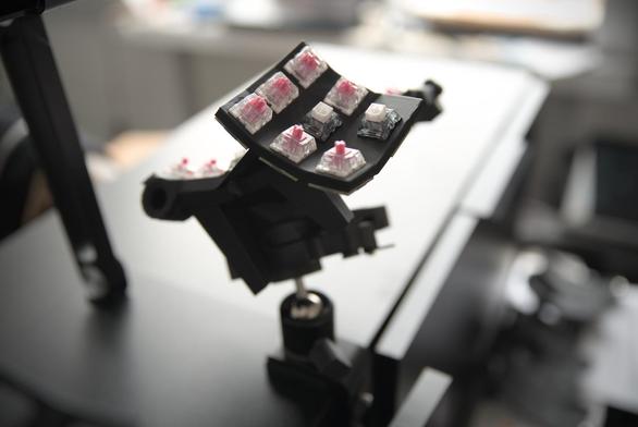 A side shot of the right side of the keyboard mounted to the desk.