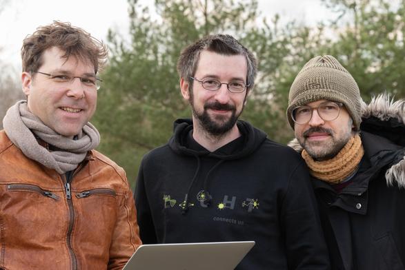 Three MPL scientists involved with the experiments smiling at the camera.