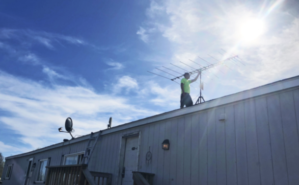 Bruce Buffalo fixing a panel on a roof