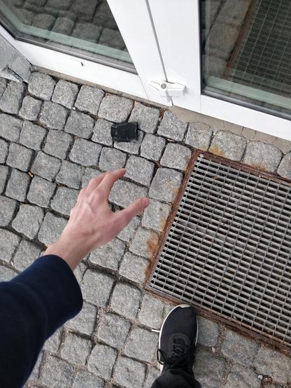 me reaching out for a rock beside the door