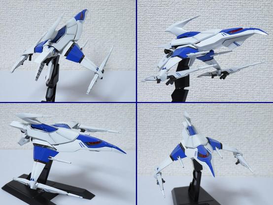 A plastic kit of a small space ship, which is painted white and blue.
Four images combined, taken from various angles.