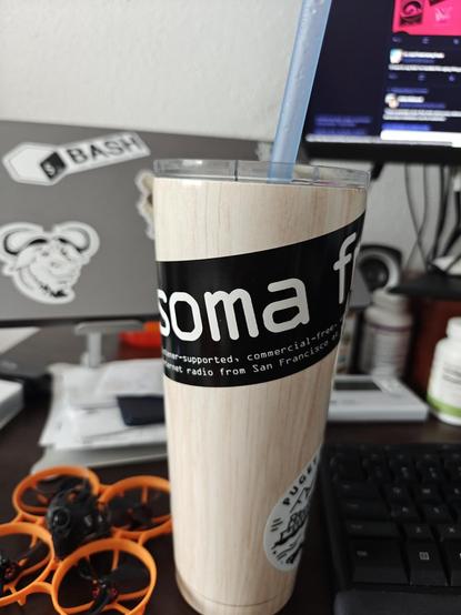 A picture of a tumbler with a somafm sticker
