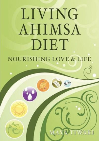A green cover, swirly Indian-suggestive patterns, circles with emblems in them suggesting seasons and food.