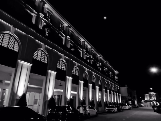 Facade of The Prestige Hotel in Penang at night