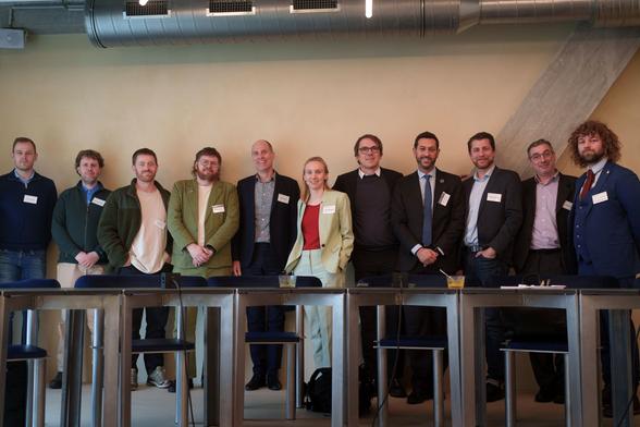 Group picture of the EU OSPO network. 11 people in a meeting room standing in front of the wall. Only one woman (me) - we need to work on the gender balance ;)