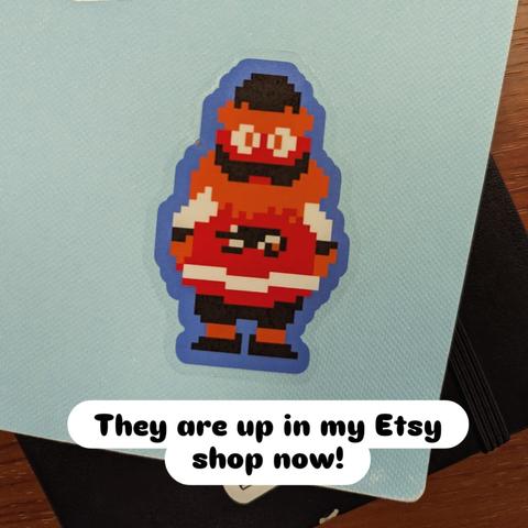 A sticker of a full body 8-bit gritty on a sketchbook