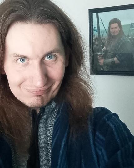 Me with a pic of me as a Highland Warrior.