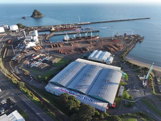 A drone photo of a banner on the roof of a huge storage facility reads
Anchor RAINFOREST KILLER
