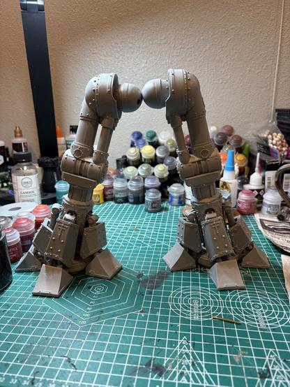 Two very large legs. The ankle guards and toes are all glued in, as are the thigh and knee pistons.