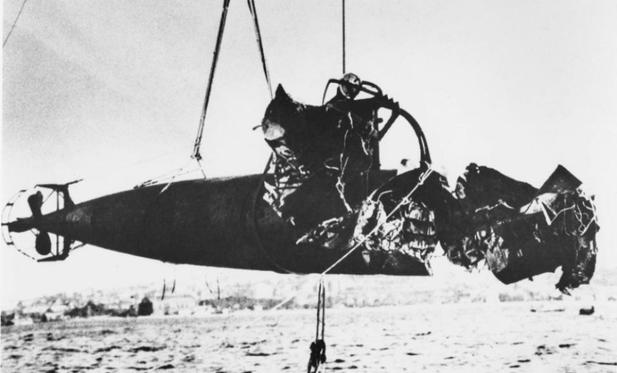 Photo of Japanese midget sub being recovered from Sydney Harbour 1942.  Image from seapower.navy.gov.au/
