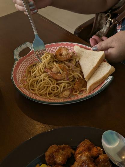 Shrimp Aglio Olio pasta with couple sandwiches