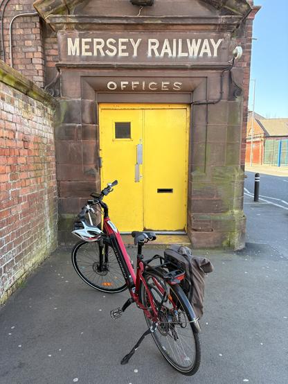 My bike by a nice bit of old signage. Mersey Railway offices is etched into the stone.