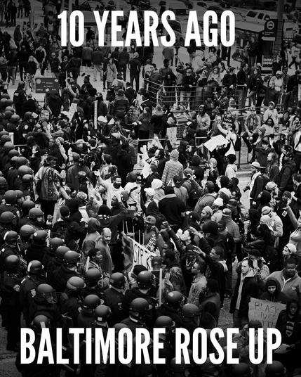 Text: 10 Years Ago, Baltimore Rose Up
Picture: A crowd confronts a phalanx of riot police