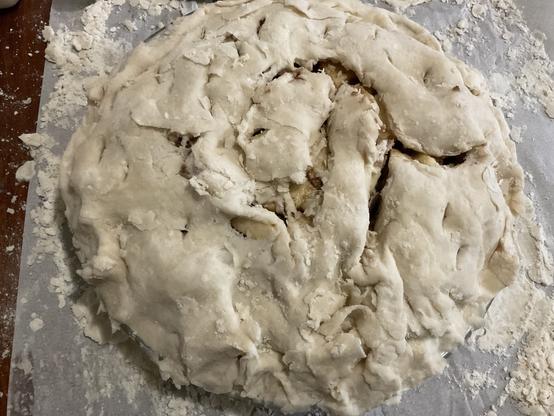 One unbaked apple pie just about ready to go into the oven.