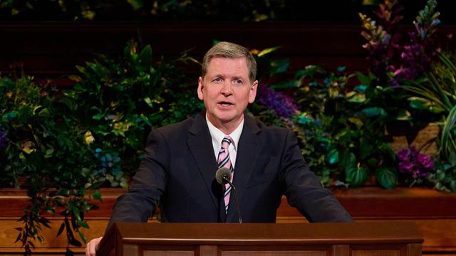Elder James R. Rasband speaks from the pulpit during the Saturday Evening Session of the 195th Annual General Conference of The Church of Jesus Christ of Latter-day Saints.