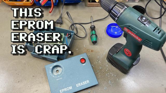 Thumbnail for my video, showing a photo of my workbench. My cheap EPROM eraser is sitting on the bench with the case removed and a new power switch fitted in the top half. There are a cordless drill and a screwdriver sitting next to it. Some screws from the device are stored in a blue lid from a peanut butter jar. The overlayed text reads "THIS EPROM ERASER IS CRAP."