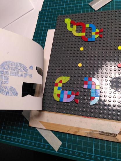 Flap flap. That way you can easily remove the mask or cover the plate without much fuzz. Flap it back.