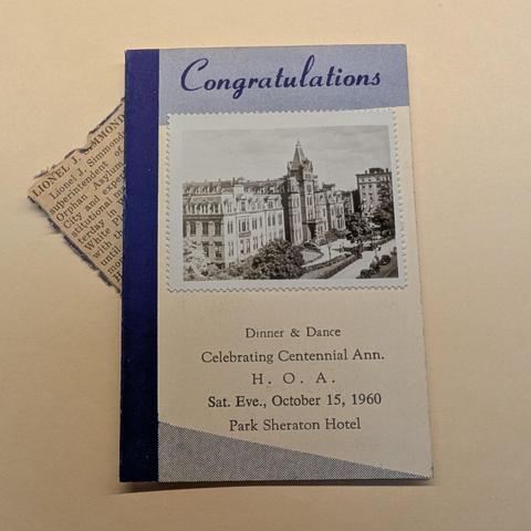 front of a pamphlet for the Dinner and Dance Celebrating Centennial Ann. H. O. A. from 1960, with a photo of the building.