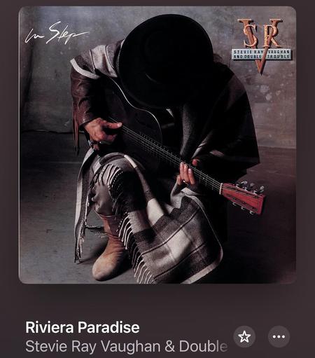 Album art from the Stevie Ray Vaughan album “In Step”. The track playing is the acoustic song “Riviera Paradise”