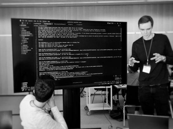 A person in front of a screen full of code