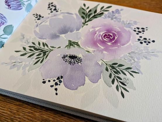 This is a watercolor painting of three flowers with filler flowers and leaves. Colors lean from reddish purple to bluish purple and the leaves are a cool green in a light and dark hue.