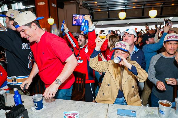 Fans enjoy Jell-O shots while celebrating.