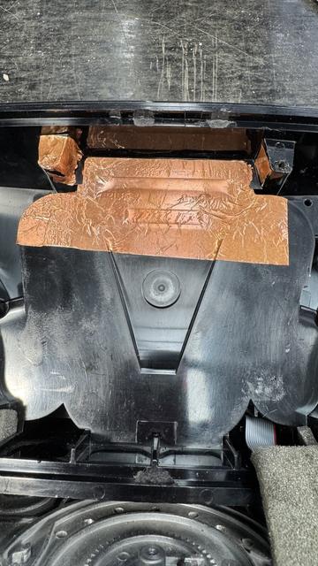 The inside of a portable sound system. Plastic, of course, but now there is a growing layer of copper foil tape all shiny, that will keep EMF out once grounded.