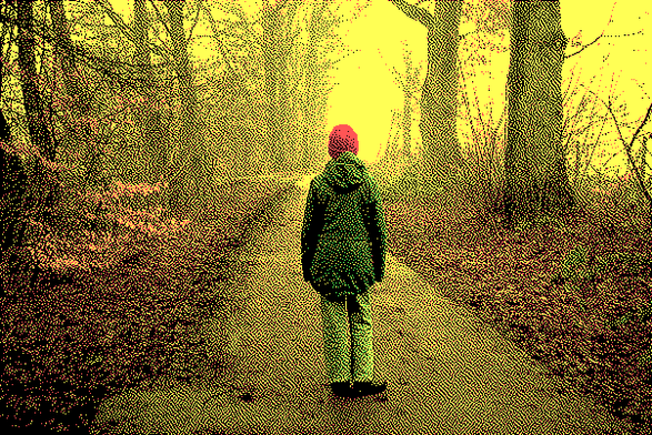 Picture of a person standing on road with a gloomy background