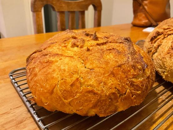 Another half the size golden crusted buttcrack bread