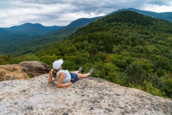 A hiker lies back at the edge of a cliff to get a photo.
© Tom Goetz. All rights reserved. Training an AI on this image is expressly forbidden.
