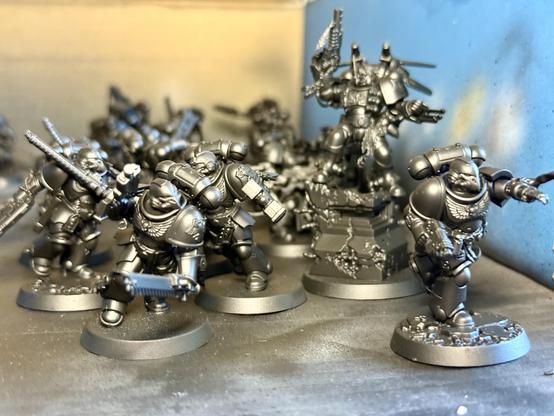 A very populous Angels of Death kill team, kitbashed by the 13yo from the starter set, various intercessors, 3d printed parts, and a bunch of stuff from the bits box. They all have bird skull helmets. Also Kayvaan Shrike is there