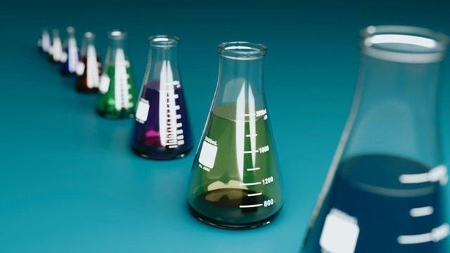 A group of Erlenmeyer flasks lined up for testing