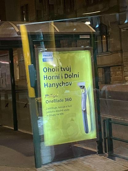 Reklama na holici strojek s textem: "Oholi tvuj Horni i Dolni Hanychov."