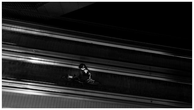 Photo of someone holding a bike in a ramp