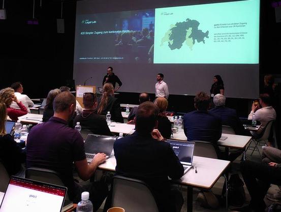 Hackathon team presenting to a roomful of hard to impress lawyers.