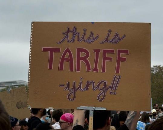 A protest sign that reads:

This is tariff
-ying!!