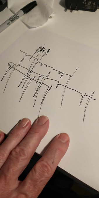 Image showing a piece of paper on which are sketched some black jagged lines, which somewhat resemble the traces from a Seismograph.