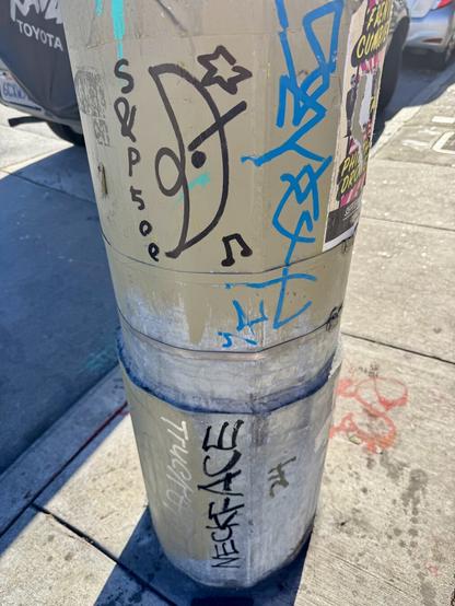 Another tag by S&P 500 drawn in black ink on a light post. It says their tagged name and has a drawing of their moon shaped character. There is also musical notation, which makes it feel like the character is listening to music or singing.