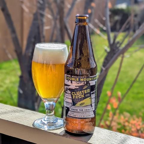 A bottle of Clusterf#ck IPA from Double Mountain Brewery of Hood River, Oregon, poured into a glass