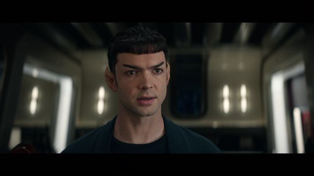 A Star Trek Strange New Worlds close-up shot of Spock standing in the doorway to his quarters as he talks with La'an (who is off-camera) on the Enterprise.  From E203