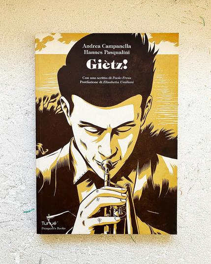 Cover for the book Giètz!. The illustration that covers all of the book is rendered in white, yellow and dark brown and features a close up of the Italian trumpet player who is the main character in the book. He is looking downwards while blowing the trumpet. Behind him the sea and the silhouette of vegetation.

Text:
Andrea Campanella, Hannes Pasqualini – Giètz!
Con uno scritto di Paolo Fresu, Postfrazione di Elisabetta Umiliani.