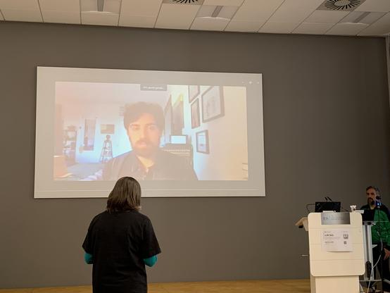 Storment’s face large on a screen