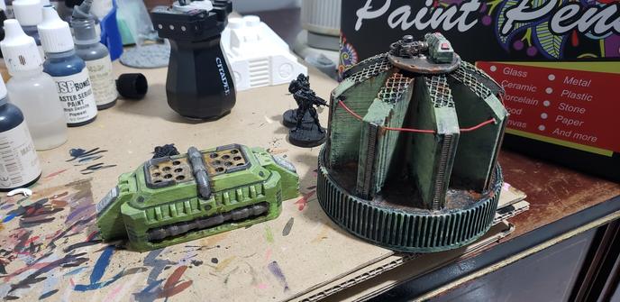 2 Green items of industrial scatter terrain. The new 3D print item is brighter in color than the older one