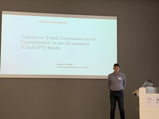 Tymbay in front of his title slide