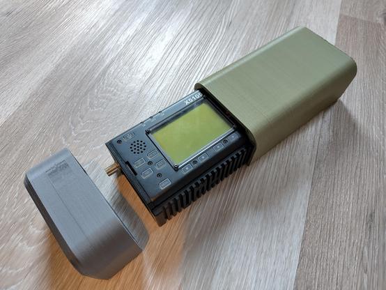 A Xiegu X5105 radio in a 3d-printed protective case.