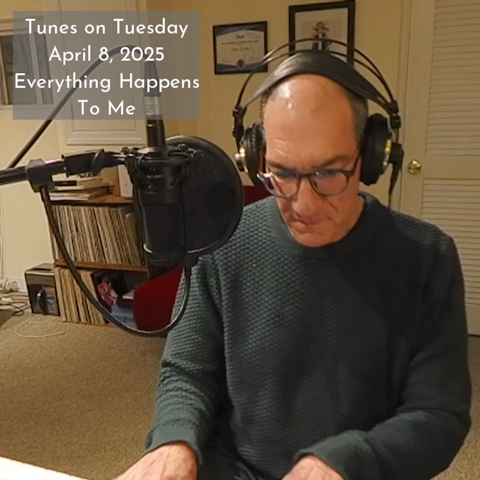 Photo of a man wearing glasses and headphones playing a piano. Text in upper left corner reads 'Tunes on Tuesday April 8, 2025 Everything Happens To Me'
